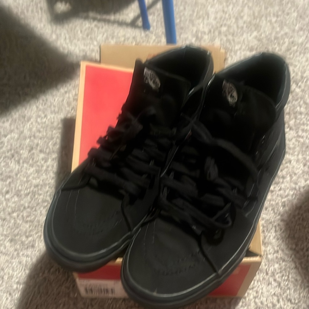 All black Hightop Vans